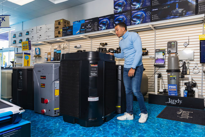 A Pinch A Penny specialist showcases pool equipment